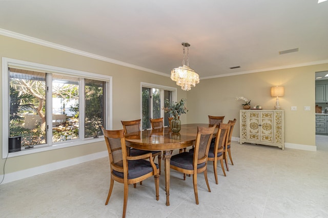 dining area with an inviting chandelier and crown molding