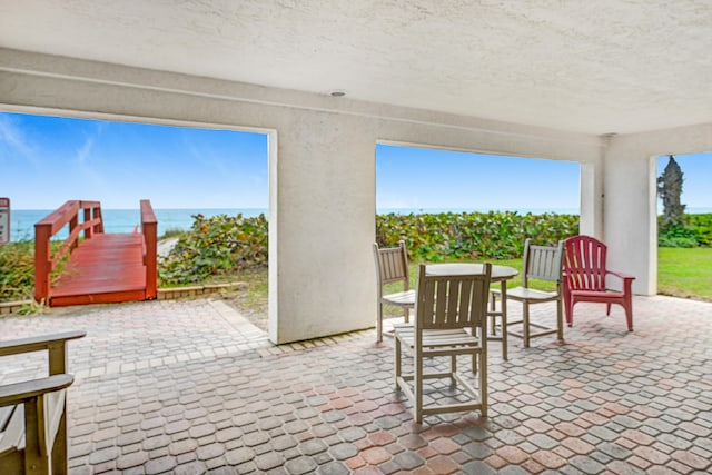 view of patio / terrace featuring a water view