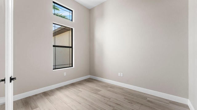 spare room with light wood-type flooring