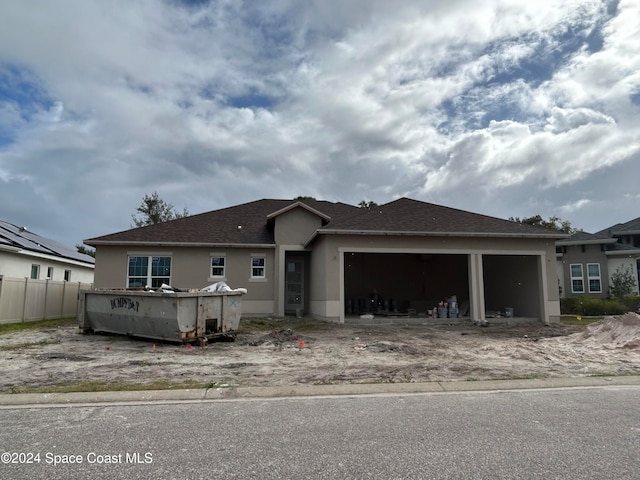 view of front of property featuring a garage