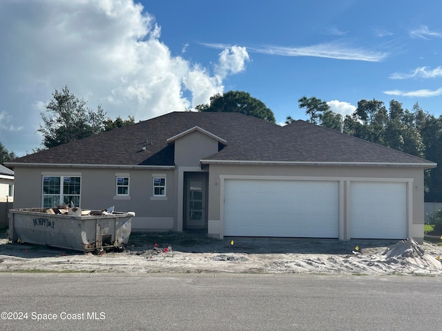 view of front of property with a garage