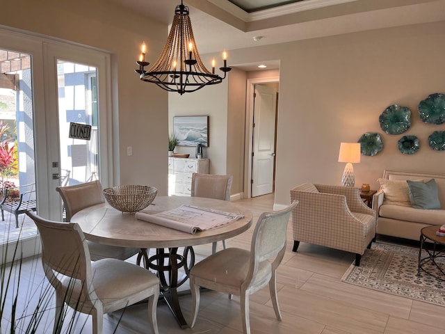 dining space featuring a notable chandelier and light wood-type flooring