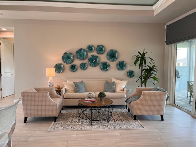 living room featuring light hardwood / wood-style floors and ornamental molding