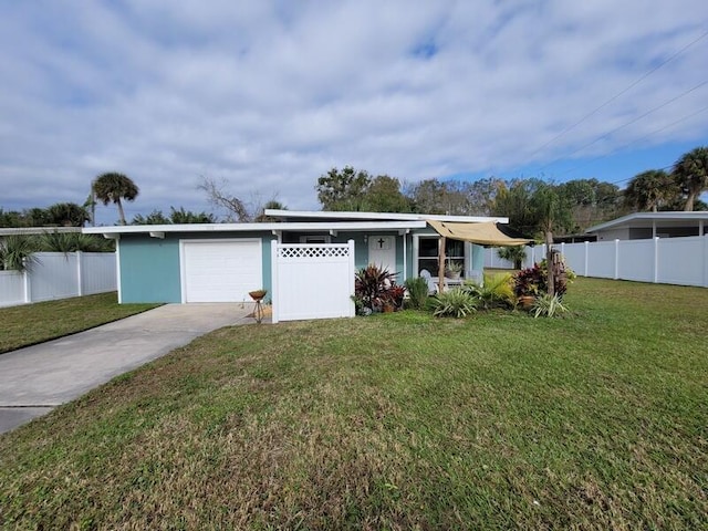 ranch-style house featuring a front lawn and a garage