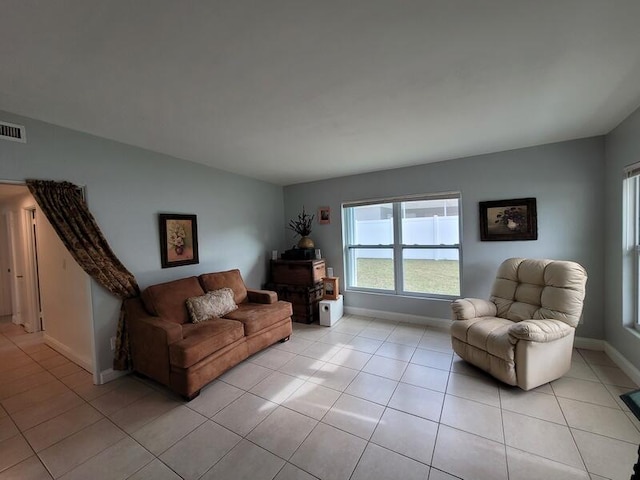 living room featuring light tile floors