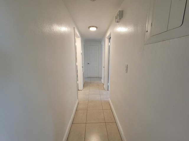 corridor featuring light tile floors