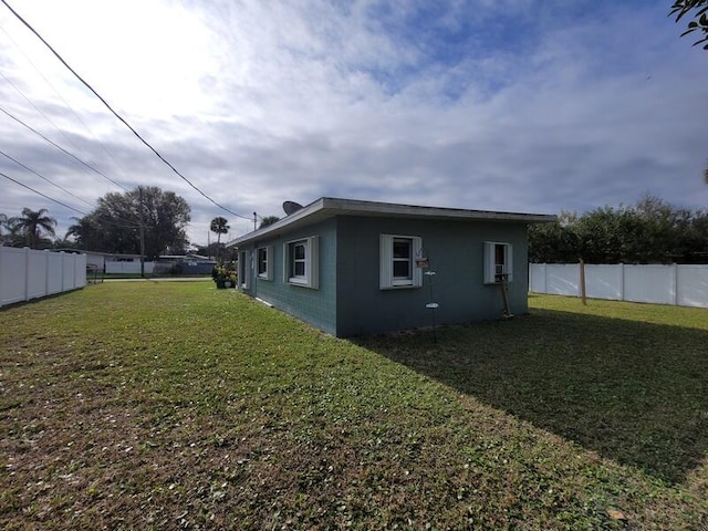 view of property exterior with a lawn