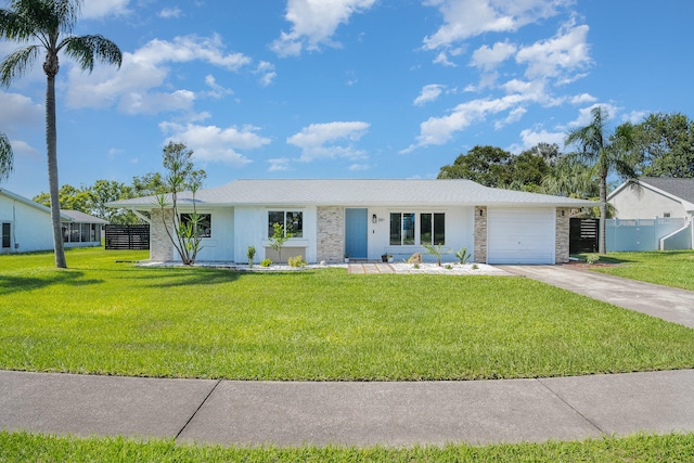 ranch-style house with a garage and a front yard