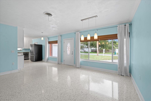 interior space with white cabinets, hanging light fixtures, plenty of natural light, and appliances with stainless steel finishes