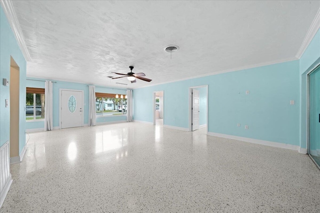 empty room with ceiling fan, a textured ceiling, and crown molding