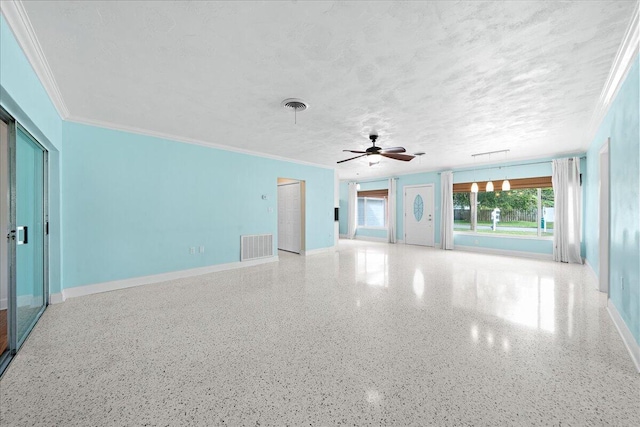 spare room with ornamental molding, ceiling fan, and a textured ceiling