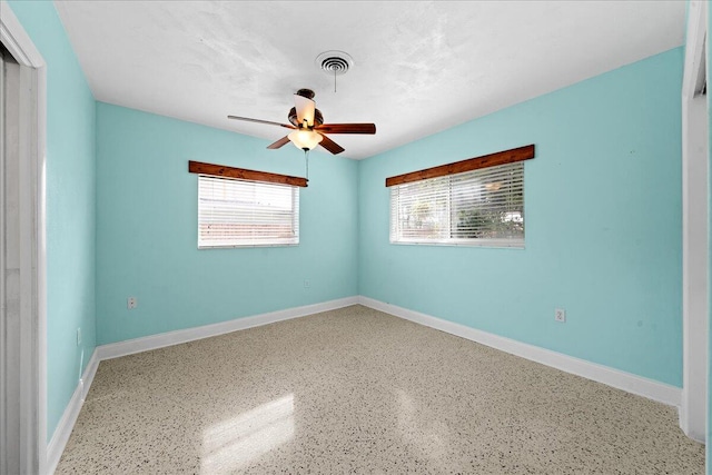 spare room with ceiling fan