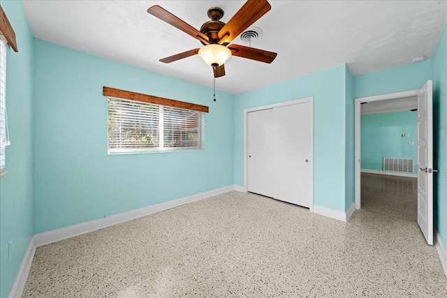 unfurnished bedroom with a closet and ceiling fan