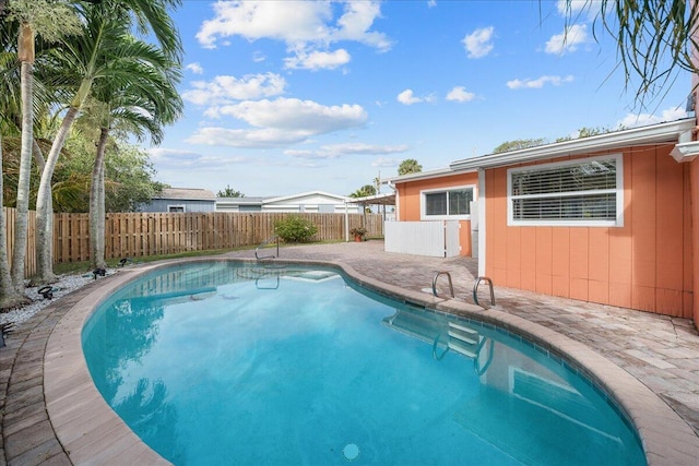 view of pool featuring a patio