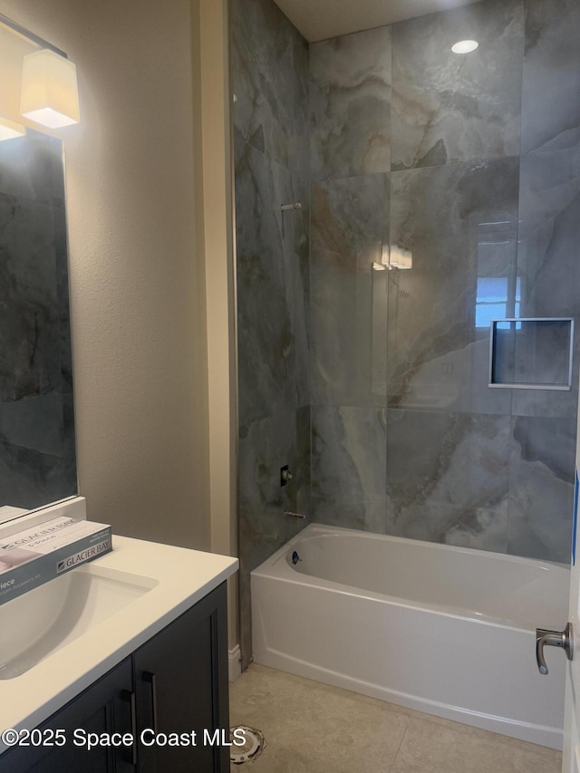 full bathroom featuring tile patterned flooring, vanity, and bathing tub / shower combination