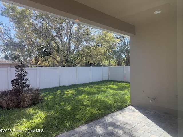 view of yard featuring a fenced backyard and a patio