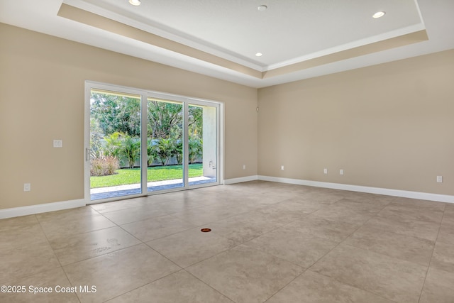 4335 Negal Cir, Melbourne, FL 32901 - spare room featuring a tray ceiling, baseboards, recessed lighting, and light tile patterned floors