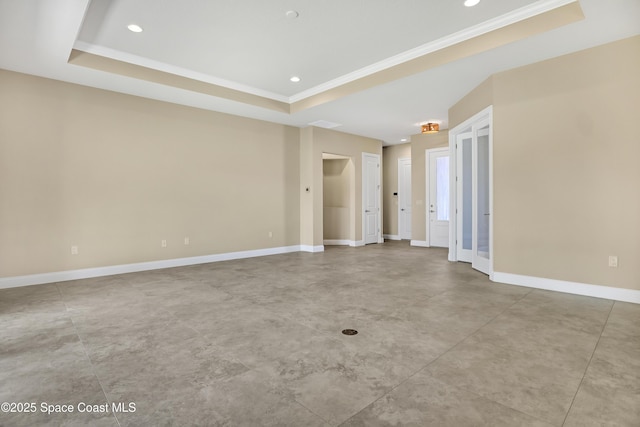4335 Negal Cir, Melbourne, FL 32901 - spare room with a tray ceiling, crown molding, baseboards, recessed lighting, and concrete floors