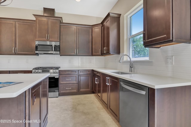 4335 Negal Cir, Melbourne, FL 32901 - kitchen featuring stainless steel appliances, a sink, light countertops, and backsplash