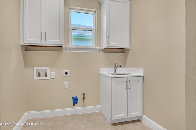 4335 Negal Cir, Melbourne, FL 32901 - clothes washing area with hookup for an electric dryer, baseboards, hookup for a washing machine, hookup for a gas dryer, and light tile patterned flooring