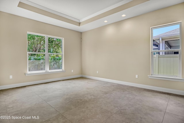 4335 Negal Cir, Melbourne, FL 32901 - spare room featuring ornamental molding, recessed lighting, baseboards, a raised ceiling, and light tile patterned floors