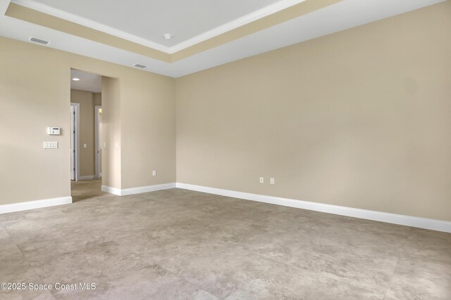 4335 Negal Cir, Melbourne, FL 32901 - unfurnished room featuring a raised ceiling and baseboards