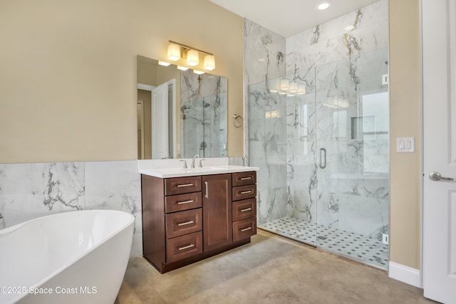 4335 Negal Cir, Melbourne, FL 32901 - full bathroom featuring a marble finish shower, vanity, a freestanding tub, and recessed lighting
