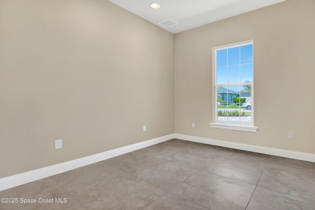 4335 Negal Cir, Melbourne, FL 32901 - spare room with baseboards, concrete flooring, and recessed lighting