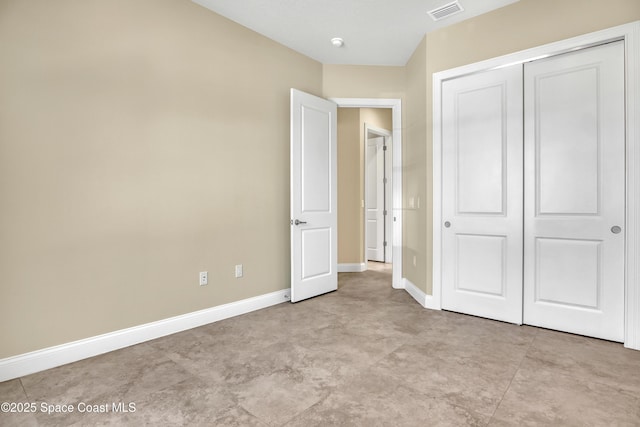 4335 Negal Cir, Melbourne, FL 32901 - unfurnished bedroom featuring a closet and baseboards