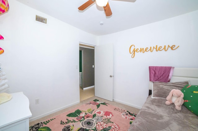 carpeted bedroom with ceiling fan