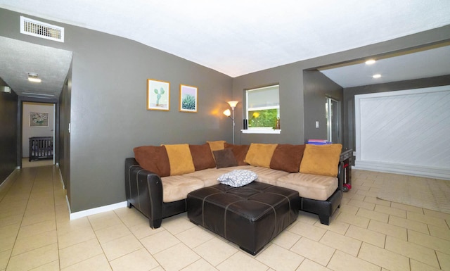 tiled living room with vaulted ceiling