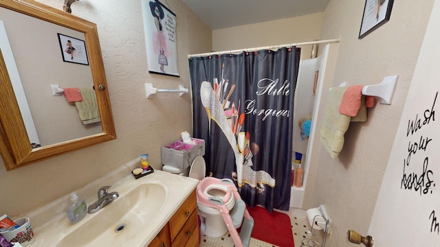 bathroom with toilet and vanity