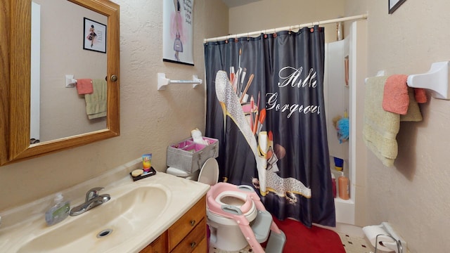 full bathroom with shower / tub combo, vanity, and toilet