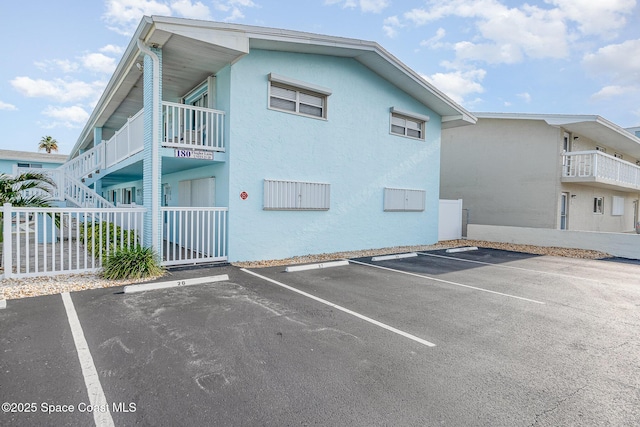 180 Flagler Ln Unit 22, Cocoa Beach, FL 32931 - view of property featuring uncovered parking