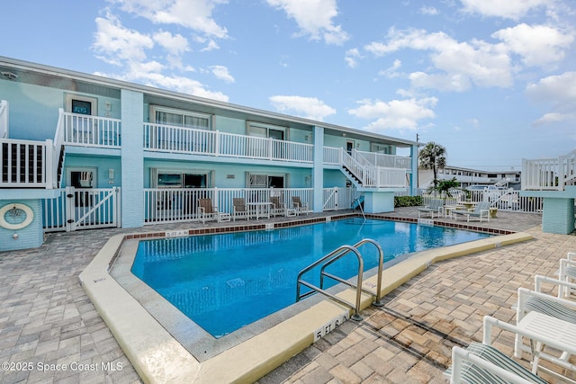 180 Flagler Ln Unit 22, Cocoa Beach, FL 32931 - community pool featuring a patio area