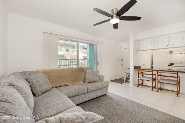 180 Flagler Ln Unit 22, Cocoa Beach, FL 32931 - living area with a ceiling fan and light tile patterned floors