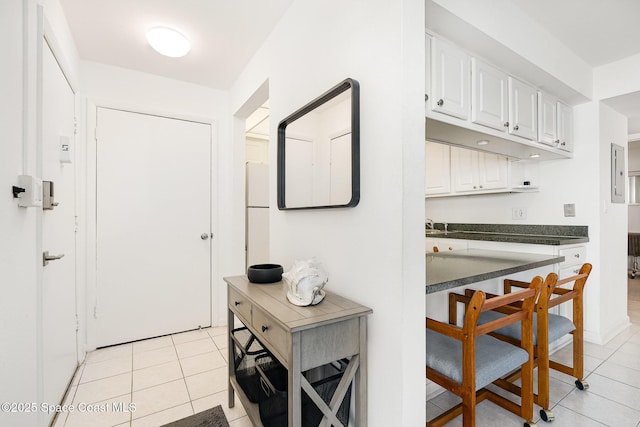 180 Flagler Ln Unit 22, Cocoa Beach, FL 32931 - corridor featuring light tile patterned floors