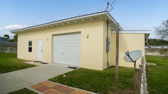 garage featuring a lawn