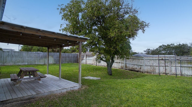 view of yard featuring a wooden deck