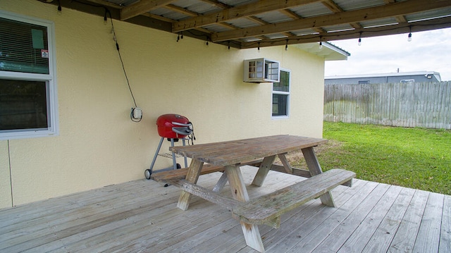 wooden deck with a lawn