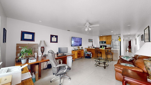 office area featuring ceiling fan and light tile floors