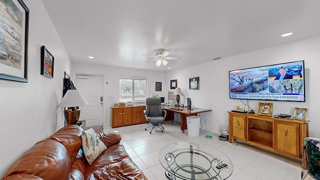 office space with ceiling fan and light tile floors