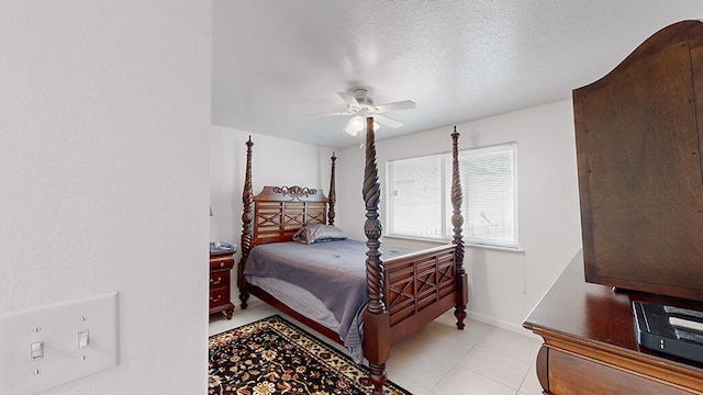 tiled bedroom with a textured ceiling and ceiling fan