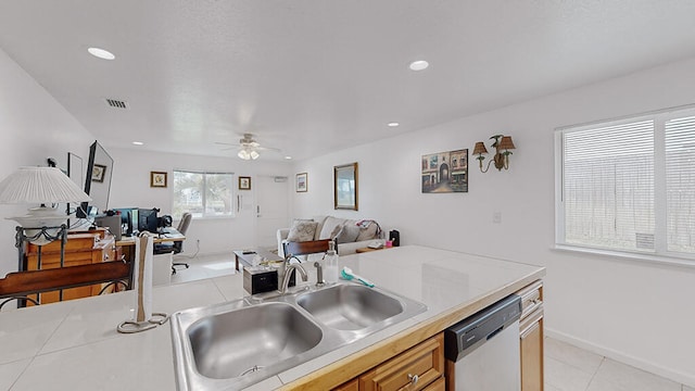 kitchen featuring light tile flooring, dishwasher, ceiling fan, tile countertops, and sink