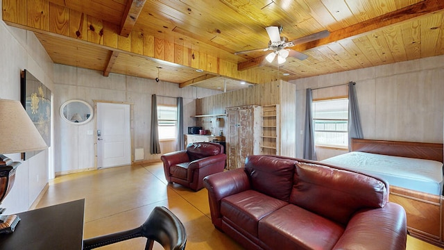 living room with beamed ceiling, wooden ceiling, and ceiling fan