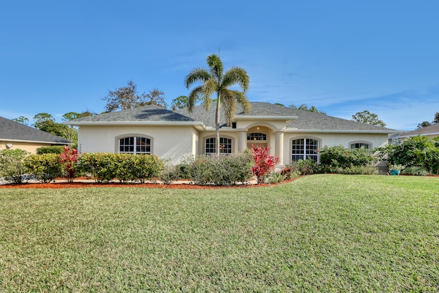 ranch-style home with a front yard