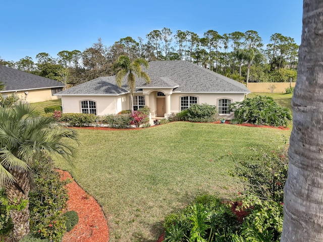 single story home with a front yard