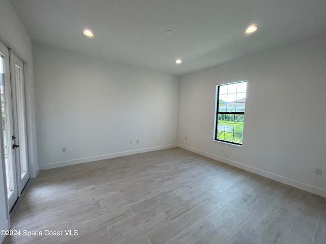 spare room featuring light hardwood / wood-style floors