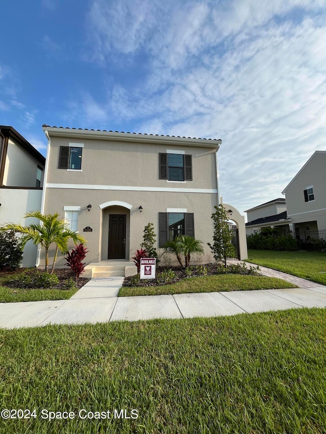 view of front of home with a front yard