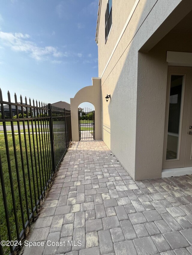 8526 Lyside Dr, Melbourne, FL 32940 - view of patio / terrace featuring fence and a gate